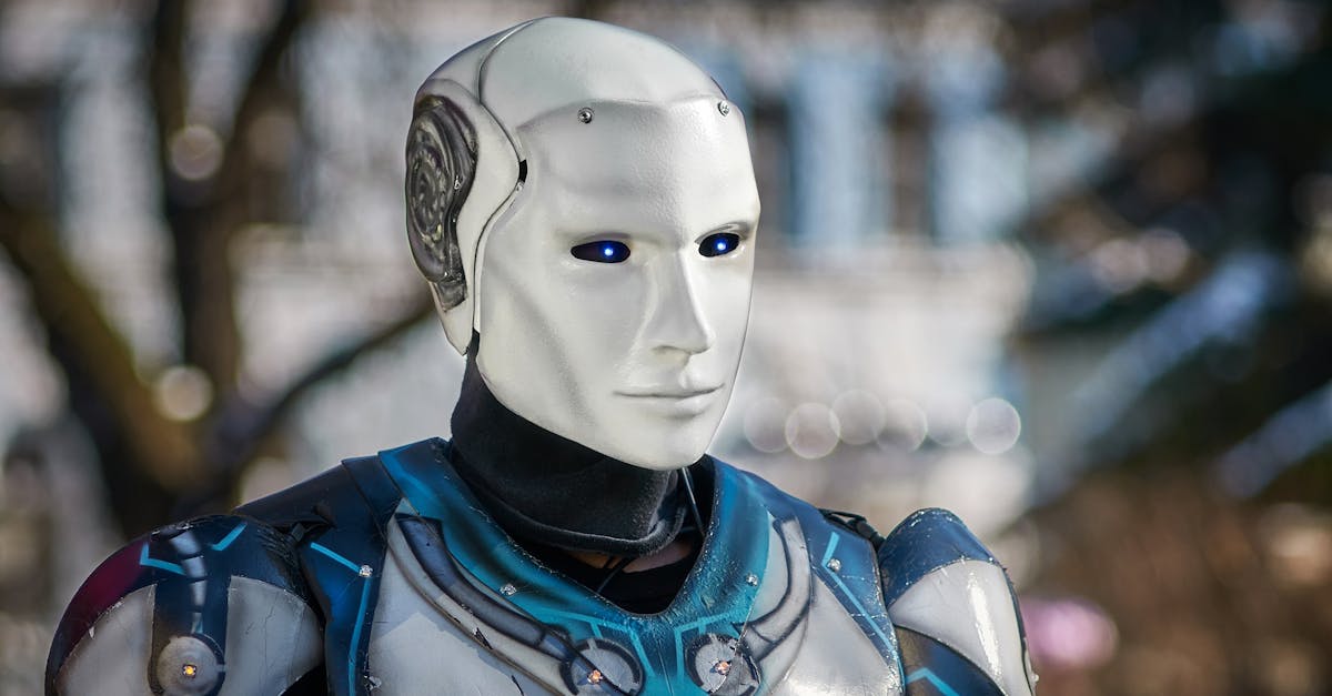 Close-up of a futuristic humanoid robot with metallic armor and blue LED eyes.